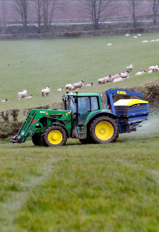 Spreading Koch Advanced Nitrogen fertiliser on Ian Daveys Penquite Farm in Cornwall during March